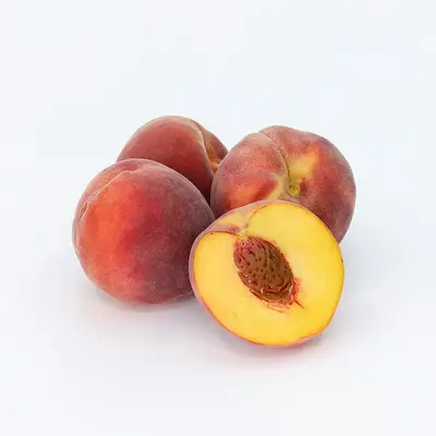 a couple of peaches sitting on top of each other