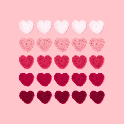 five rows and columns of knitted hearts