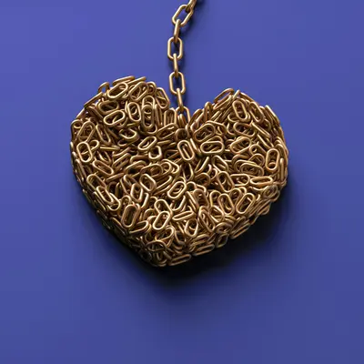 a heart shaped object with a chain attached to it