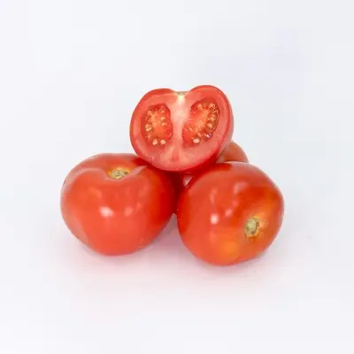 a group of three tomatoes sitting on top of each other