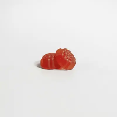 a red strawberry on a white background