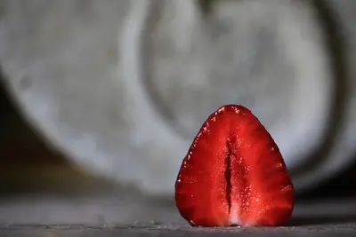 a close up of a tomato with water droplets on it