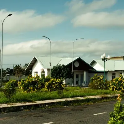 a couple of houses sitting on the side of a road